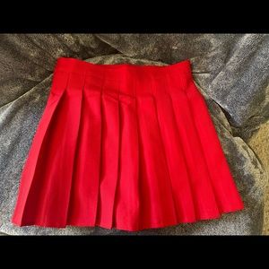 Red pleated mini skirt